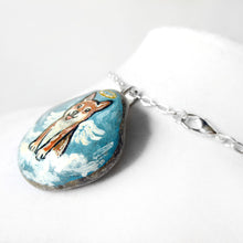 Load image into Gallery viewer, a smooth beach stone, hand painted with a portrait of a shiba inu dog as an angel, sitting on clouds against a light blue sky. available as a keepsake or pendant necklace
