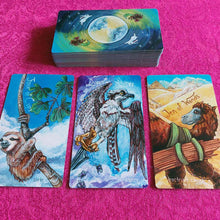 Load image into Gallery viewer, The Animism Tarot BORDERLESS Edition: the deck, with the Four of Cups, Queen of Swords, and Ten of Wands
