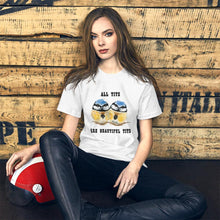 Load image into Gallery viewer, A woman wearing the Beautiful Tits Premium Unisex T-shirt in white with art of two blue tit birds, and the words, "all tits are beautiful tits"
