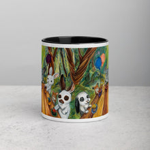 Load image into Gallery viewer, An 11 oz ceramic coffee mug, with black trim, printed with artwork of a cupcake party with three rabbits, two hamsters and a chinchilla in the forest
