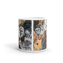 Load image into Gallery viewer, An 11 oz white ceramic mug, printed with art of many different types of bunnies
