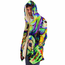 Load image into Gallery viewer, a man wears the bunny lovers rainbow cloak, featuring a bright, all-over rainbow print of different rabbit breeds

