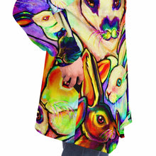Load image into Gallery viewer, a man wears the bunny lovers rainbow cloak, featuring a bright, all-over rainbow print of different rabbit breeds. IT HAS POCKETS.
