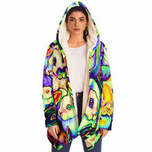 Load image into Gallery viewer, a woman wears the bunny lovers rainbow cloak, featuring a bright, all-over rainbow print of different rabbit breeds
