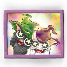 Load image into Gallery viewer, an art print featuring an illustration of a black cat wearing a green witch hat, and a white cat wearing a purple witch hat. with stars in their eyes, they're looking at the viewer in awe.
