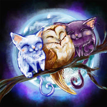 Load image into Gallery viewer, an art print featuring an illustration of a white cat, barn owl, and black cat, all sleeping in a row, perched on a tree branch. the full moon shines behind them.
