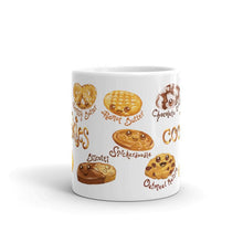 Load image into Gallery viewer, The Cookie Lovers Smile Mug in 11 oz size, includes a graphic of 10 different cookies with cartoon faces on them
