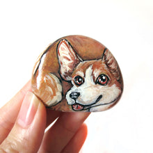 Load image into Gallery viewer, a beach rock with dog art: a portrait painting of a smiling corgi with its tongue sticking out
