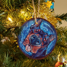 Load image into Gallery viewer, A Christmas wood ornament, featuring a painting of a doberman with a big blop of the tongue.
