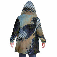 Load image into Gallery viewer, a man wearing a navy blue and orange cloak, featuring art from the Eight of Cups card, from the Animism Tarot: a magpie, with wings spread, flies up into the night sky.
