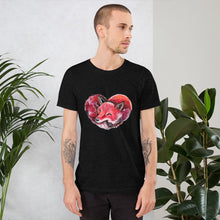 Load image into Gallery viewer, A man is wearing the Fox Love Premium Unisex T-shirt in the colour black heather, which includes art of a red fox sleeping in the shape of a heart.
