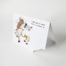 Load image into Gallery viewer, a funny greeting card with a goat on the front, with the bottom right corner of the card ripped and hanging from its mouth. the card reads, "I got you a card and I eated it"
