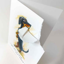 Load image into Gallery viewer, a greeting card featuring an illustration of a dachshund standing on its hind legs. the top right corner of the card is ripped off and hangs from the dog's mouth. the card reads, I got you a card! .. but I eated it
