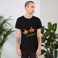 Load image into Gallery viewer, A man wearing the I Believe in You Leaf Premium Unisex T-Shirt in the colour heather black, which includes art of two maple leaves and the words, "I be-leaf in you"
