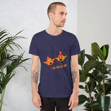 Load image into Gallery viewer, A man wearing the I Believe in You Leaf Premium Unisex T-Shirt in the colour heather midnight navy blue, which includes a graphic of two maple leaves and the words, "I be-leaf in you"
