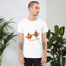 Load image into Gallery viewer, A man wearing the I Believe in You Leaf Premium Unisex T-Shirt in the colour white, which includes a graphic of two maple leaves and the words, "I be-leaf in you"
