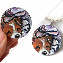 Load image into Gallery viewer, a small wood circle, hand painted with a jack russell terrier dog, curled up sleeping. available as a wood keepsake or pendant necklace
