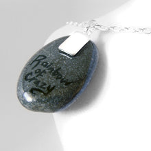 Load image into Gallery viewer, the back of a painted pug angel necklace, signed with "rainbow of crazy"
