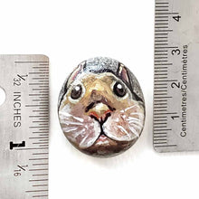 Load image into Gallery viewer, a small beach stone, hand painted with the fact of a creme d'Argent rabbit, available as a keepsake or pendant necklace
