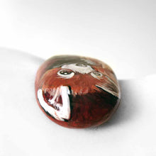 Load image into Gallery viewer, rock art, hand painted with a red panda hugging its tail
