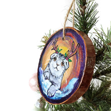 Load image into Gallery viewer, A wood Christmas ornament, hand painted with a portrait of a Scottish fold cat with reindeer antlers, sitting on the snow.
