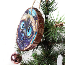 Load image into Gallery viewer, A Christmas ornament with a painting fo a blue eyed Siamese cat's face
