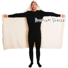 Load image into Gallery viewer, a man wears the Sleepy Cats Hooded Blanket, featuring illustrations of different sleeping cats, lined with premium sherpa
