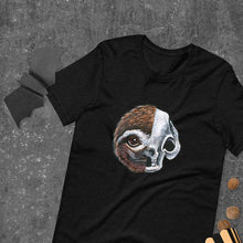 Load image into Gallery viewer, A premium unisex t-shirt in the colour black, features a print of a split image: a skull's face on the left side and a sloth skull on the right.
