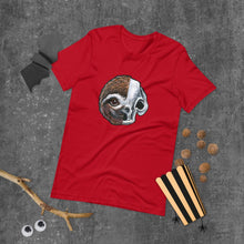 Load image into Gallery viewer, A premium unisex t-shirt in the colour red, features an illustration of a split image: a skull's face on the left side and a sloth skull on the right.
