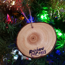 Load image into Gallery viewer, The back of a sphynx cat ornament, signed with, Rainbow of Crazy
