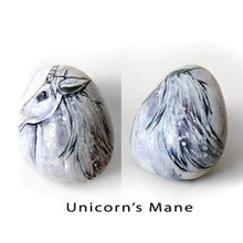 Load image into Gallery viewer, a stone hand painted with the portrait of a unicorn with purple eyes

