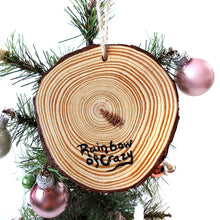 Load image into Gallery viewer, The back of the white rabbit wood ornament, signed with, Rainbow of Crazy
