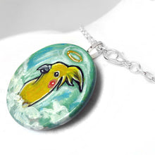 Load image into Gallery viewer, art of a yellow cockatiel as an angel in the clouds, painted on a small wood disc, available as a keepsake or necklace
