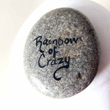 Load image into Gallery viewer, a beach stone, hand painted with the portrait of a black and brown yorkie's face, signed on the back with, Rainbow of Crazy
